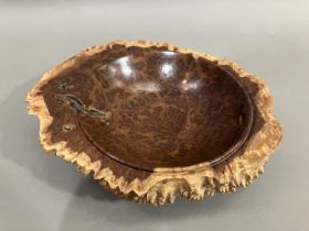 A turned walnut fruitbowl, the exterior formed as bark with a smooth interior