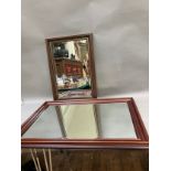 Two wooden framed wall mirrors, largest measuring 73cm x 106cm