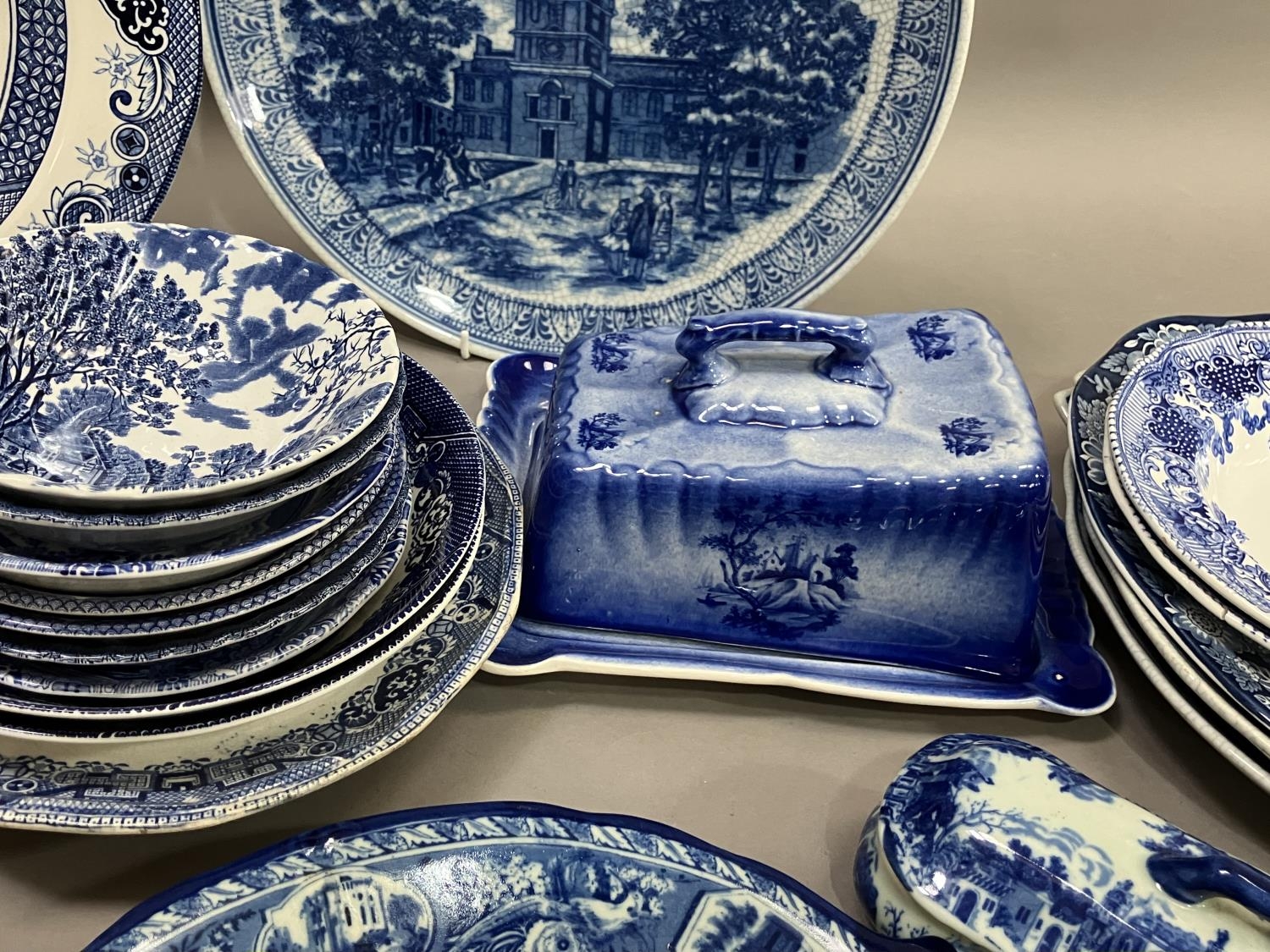 A collection of blue and white ware including 19th century willow pattern plates, later wild rose - Image 3 of 3