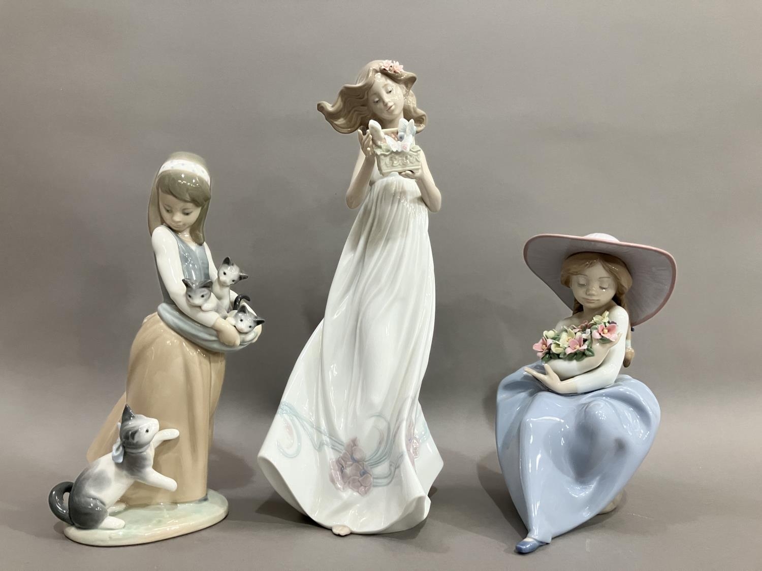 Three Lladro figures, Butterfly Treasures 6777, Girl with her Kittens, Girl with Flowers no.5862 (3)