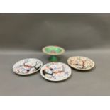 Three Royal Crown Derby plates, underglaze blue, iron red and green enamel with birds perched in a
