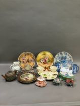A collection of ceramics comprising a moulded hors d'oeuvres tray formed as a basket with lilies,