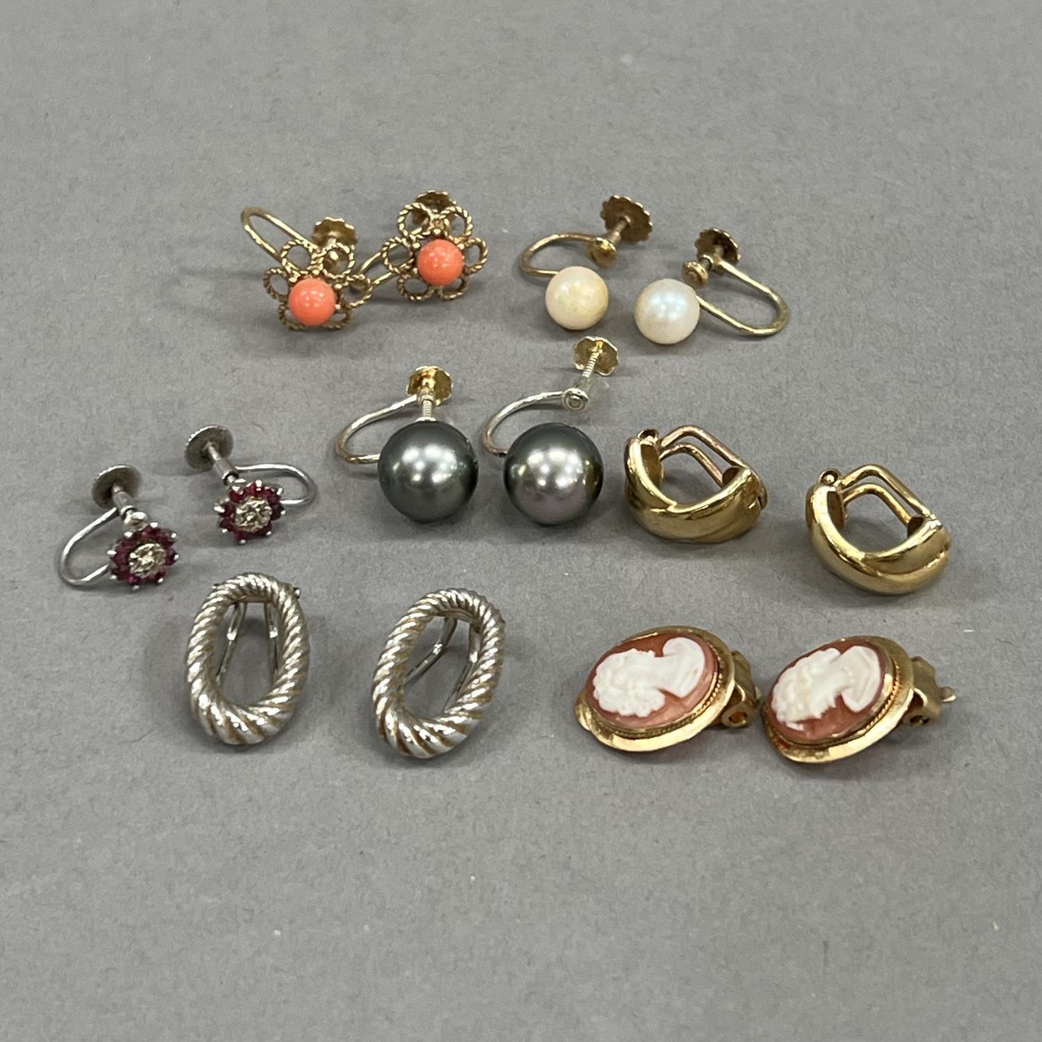 Seven pairs of earrings all with clip or screw fittings and all in yellow or white metal (tests as