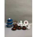 A collection of 1970s items including a pink and white coffee pot cups and tea plate, a brown