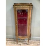 A reproduction kingwood and metal mounted vitrine, bow fronted profile, having a single door and