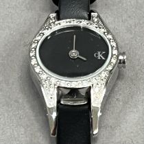 A Calvin Klein lady’s quartz wrist watch in a diamond set stainless steel case, no. K2723 00,