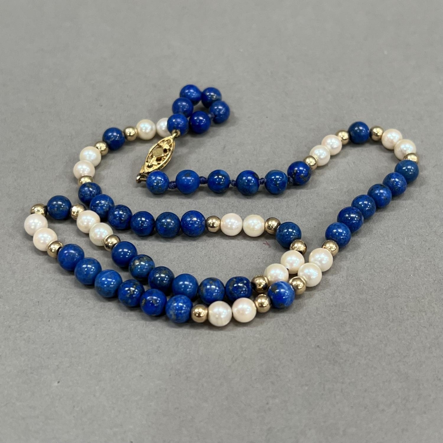 A necklace of spherical 6mm diameter Lapis Lazuli beads, 5.5mm diameter cultured pearls and 4mm - Image 2 of 2
