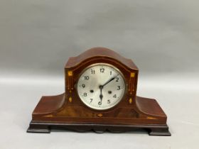 An early 20th century mahogany and inlaid mantel clock having silvered dial with black Arabic