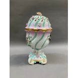 Early 20th century Dresden potpourri pedestal vase and domed cover of wrythern form, tinted puse and