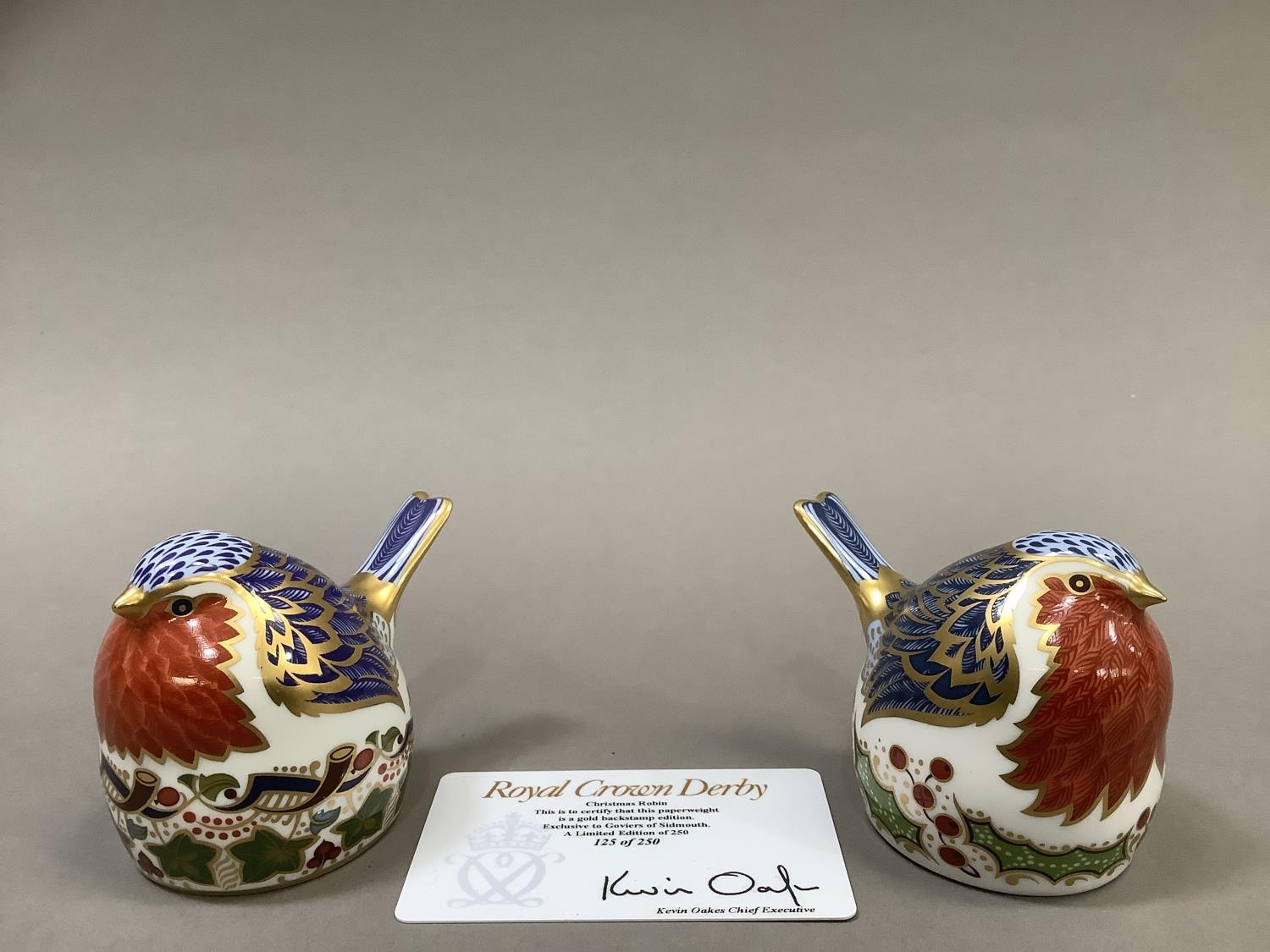 Two Royal Crown Derby Christmas robins, one a pre-release edition of 250 exclusive to Goviers of