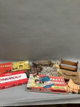 Three vintage board games including Cluedo and Monopoly, two curtain tassels, a python skin handbag,
