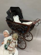 Two dolls with porcelain heads and limbs, jointed bodies and together with a modern realistic doll