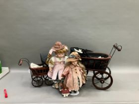 Two modern ceramic dolls with jointed bodies and Victorian style pram together with another