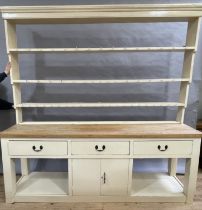 A late 19th century estate painted and stripped pine dresser and rack having a moulded cornice above