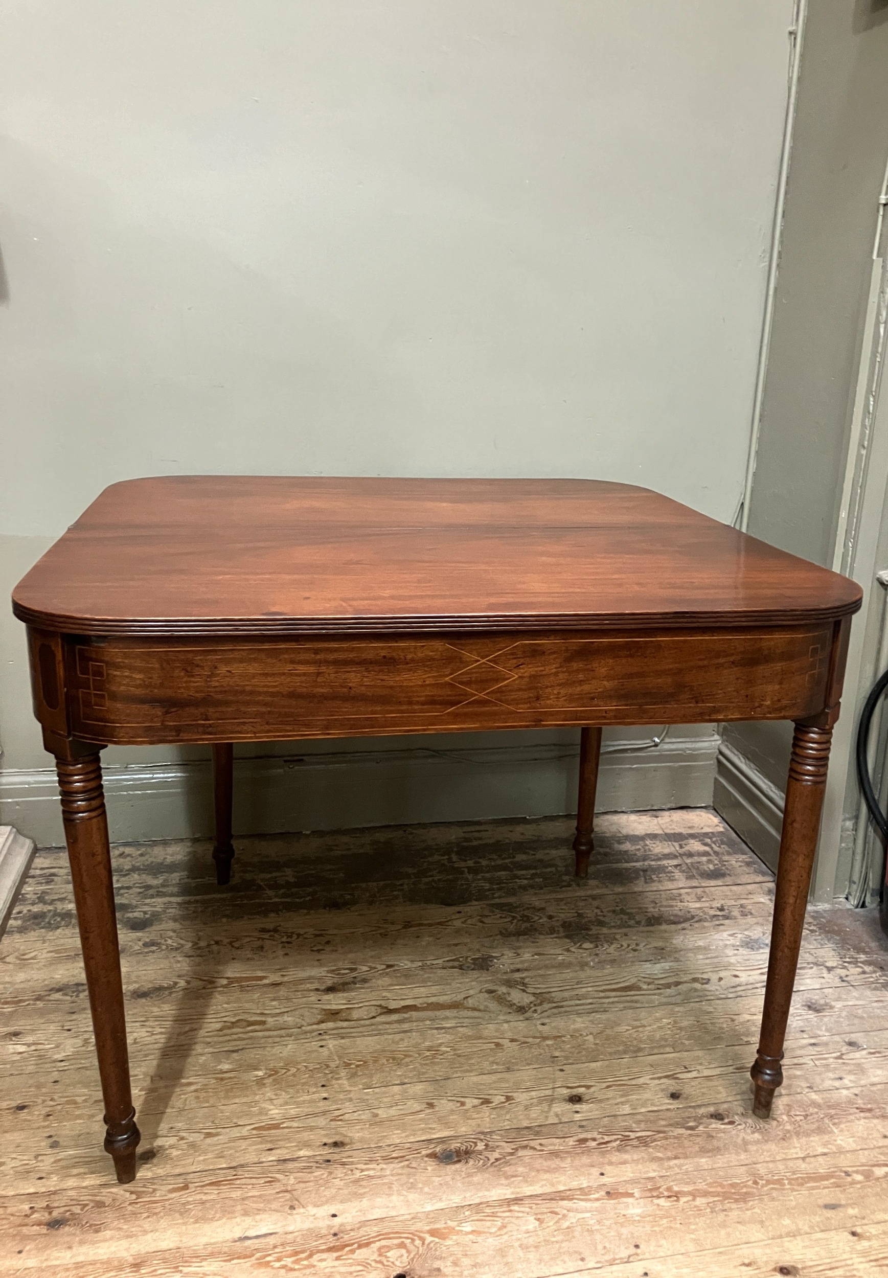 A 19th century mahogany tea table, rectangular having a fold over top with boxwood inlay to the - Image 4 of 5