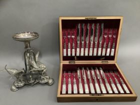 A late Victorian mahogany canteen of twelve mother of pearl handled silver plated dessert knives and
