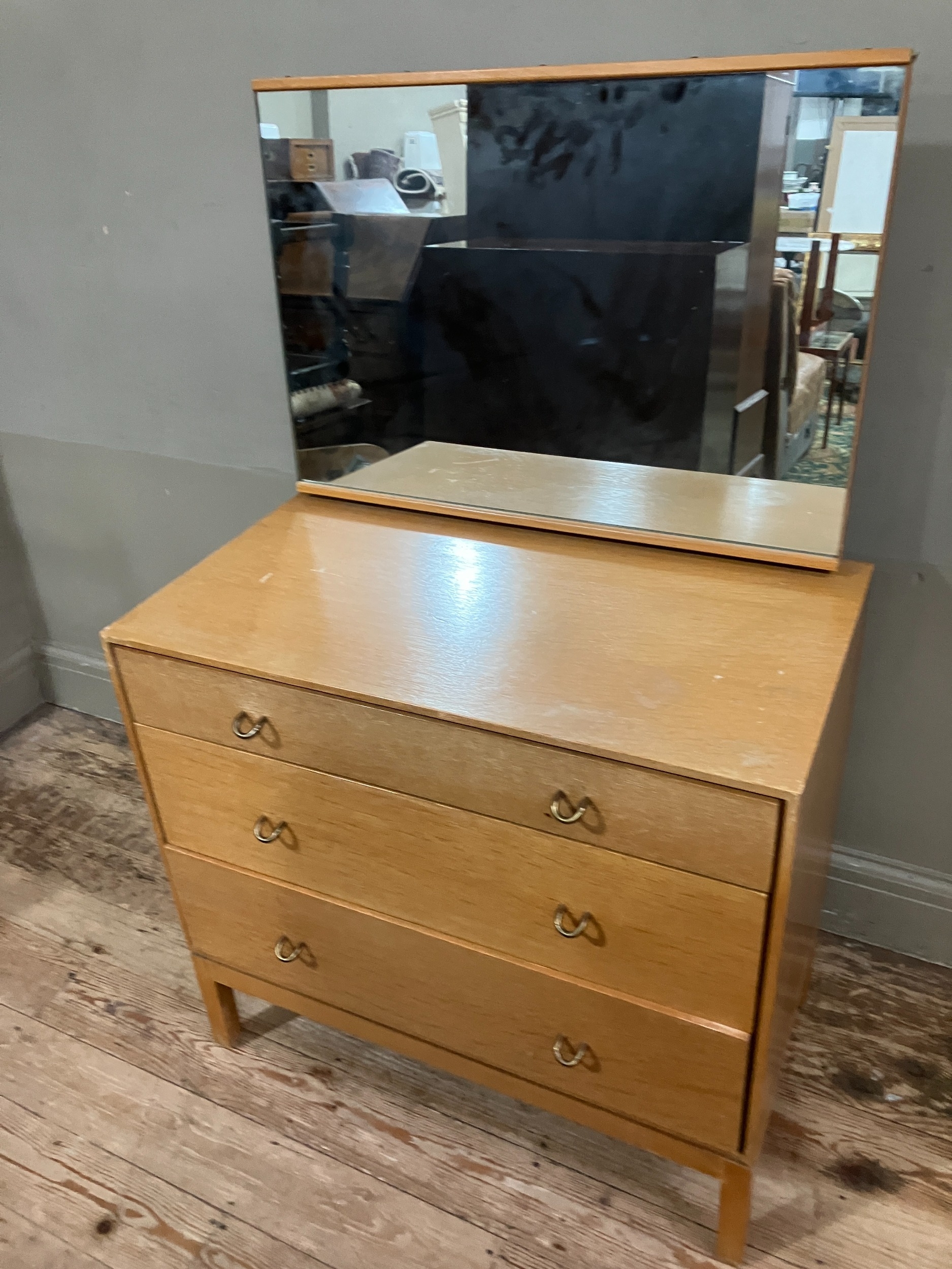 A 1960s Stag pale oak dressing chest having an adjustable mirror over three graduated drawers, on - Image 3 of 4