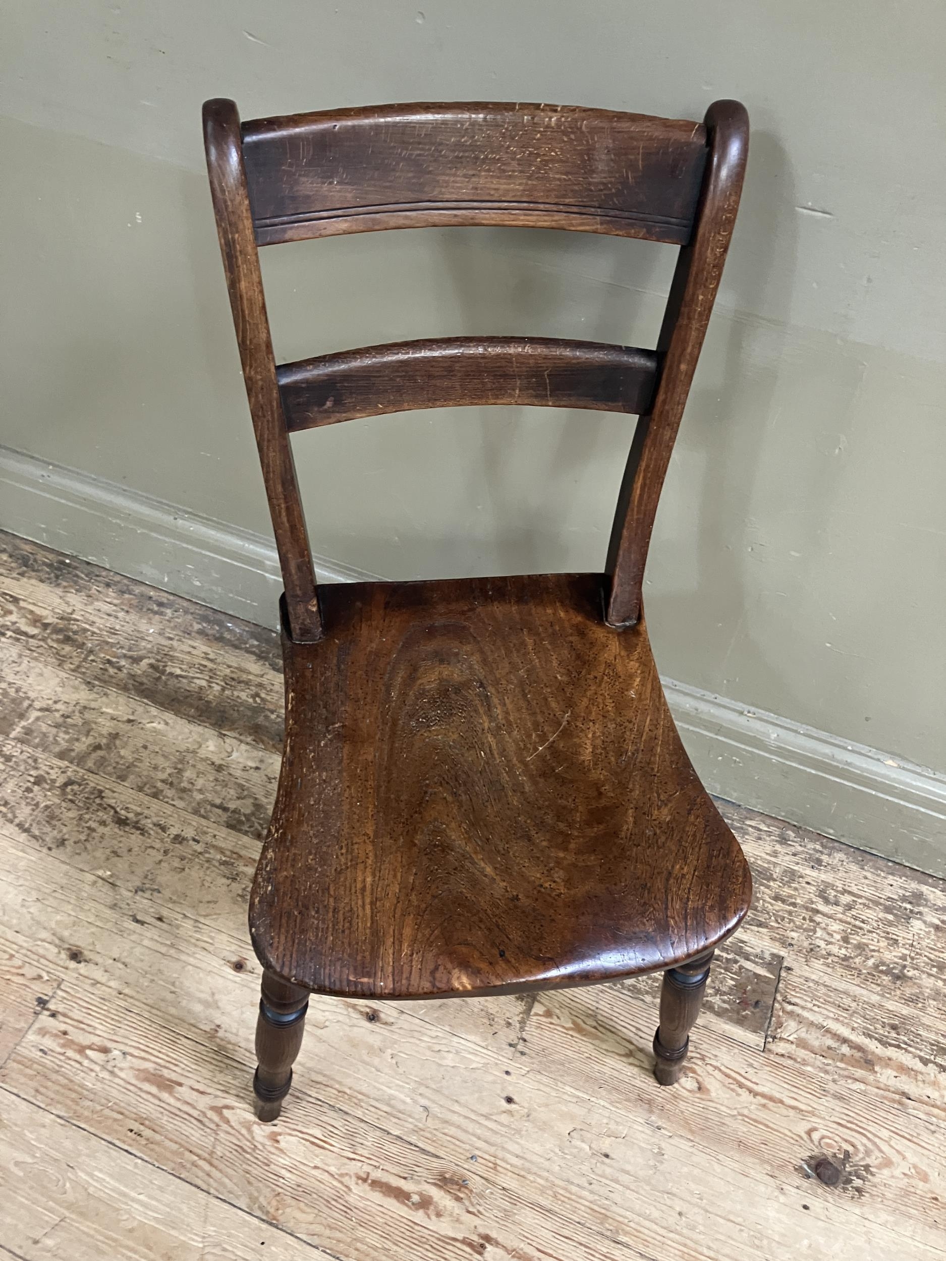 A late 19th/early 20th century fruitwood kitchen chair with bar back and tie rail, saddle shaped - Image 2 of 2