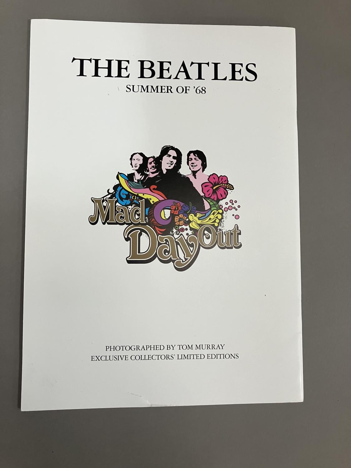 A Coalport Characters Beatles Yellow Submarine plaque, together with a Mad Day Out photoshoot book - Image 2 of 3