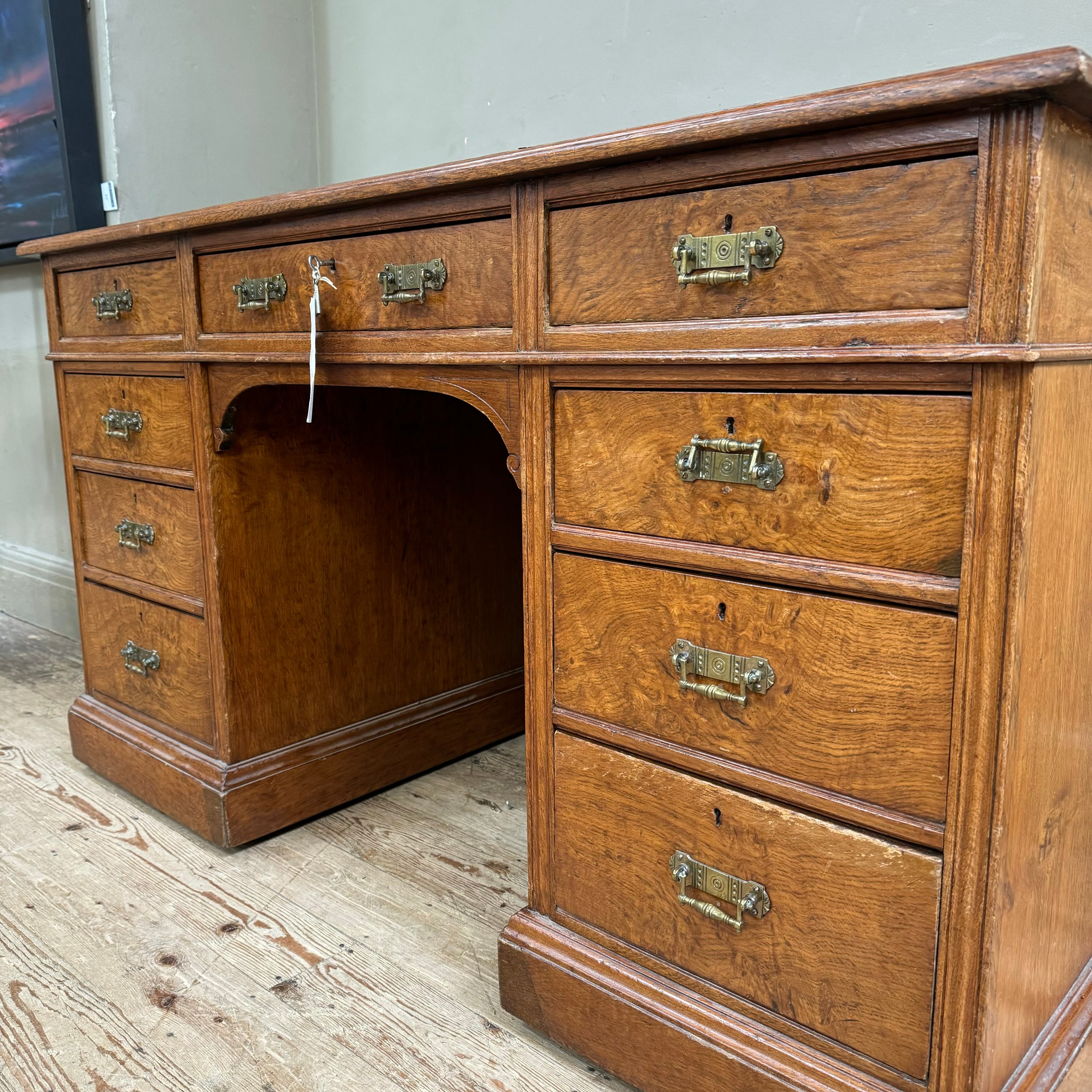 A Victorian oak kneehole desk having three drawers across and three further drawers to either side - Image 2 of 2