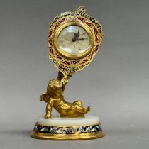 A Swiss champlevé enamel and gilt metal mantel clock, the silvered dial with black Roman numerals,