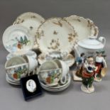 A French china part dessert service comprising two oval serving dishes, two circular ones and two