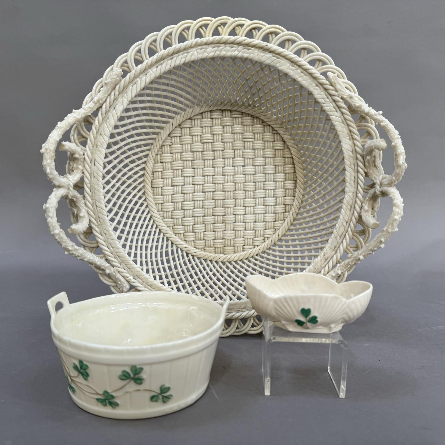 A Belleek two handled circular basket with pierced rim, strap mark to underside Belleek Co