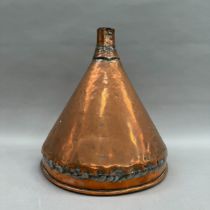 A large copper funnel 32.5cm high