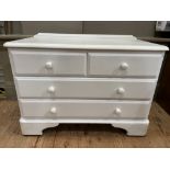 A white painted, possibly pine, chest of two short over two long drawers on bracket feet, 88cm x