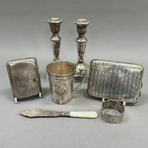 An early 20th century Continental 935 silver cup, tapered scales scroll taped handle, foliate