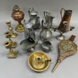 A copper and brass oil lamp base, copper jug, a pair of brass candlesticks and a single candlestick,