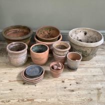 A collection of terracotta plant pots measuring from 27.5cm high to 10cm together with a stone mix
