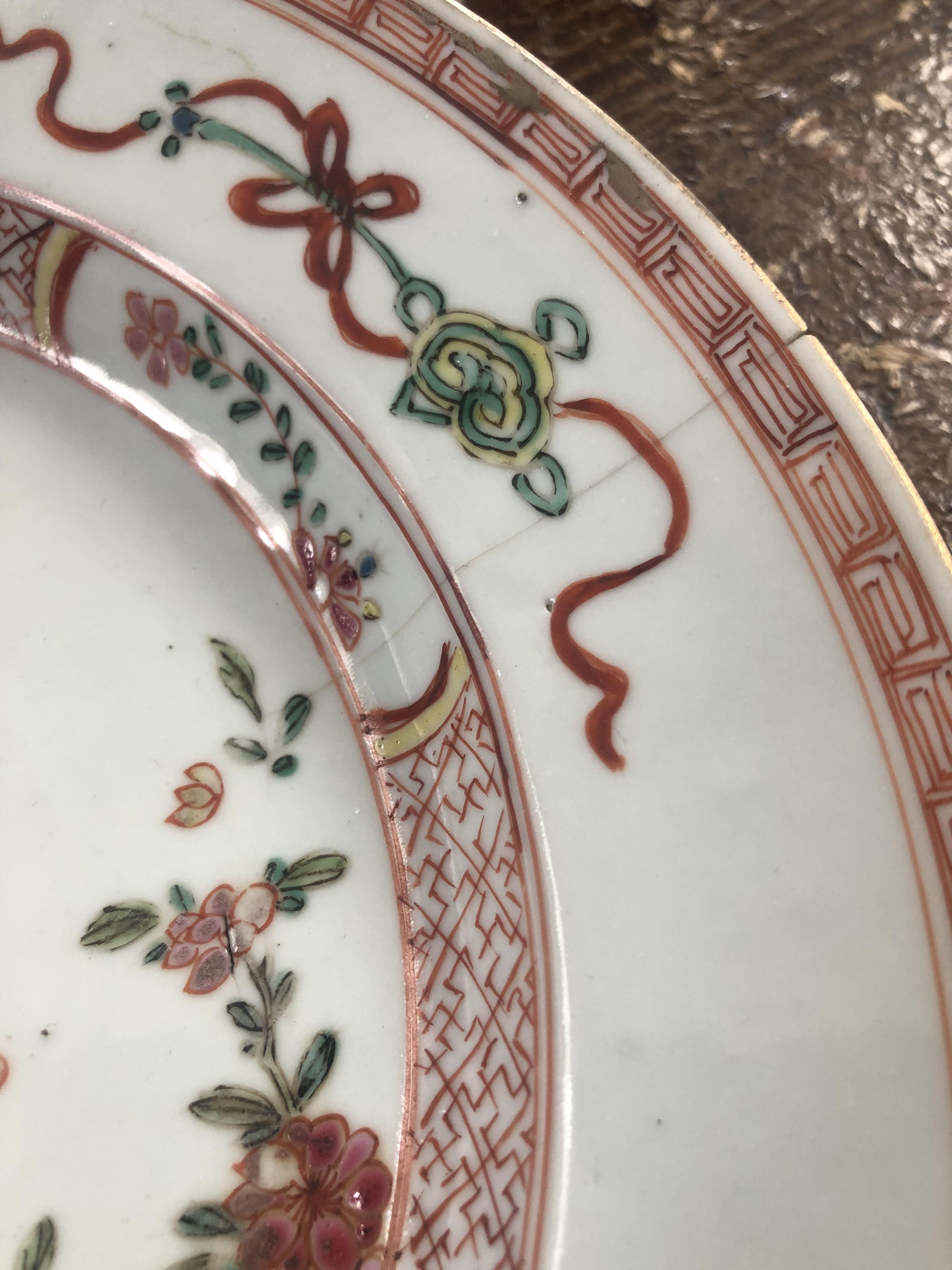 A pair of early 20th century famille rose plates painted to the centre with rocks issuing peony - Image 6 of 9
