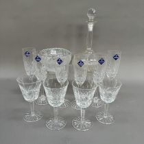 A set of six Edinburgh Crystal champagne flutes together with four Waterford wines, in two sizes,