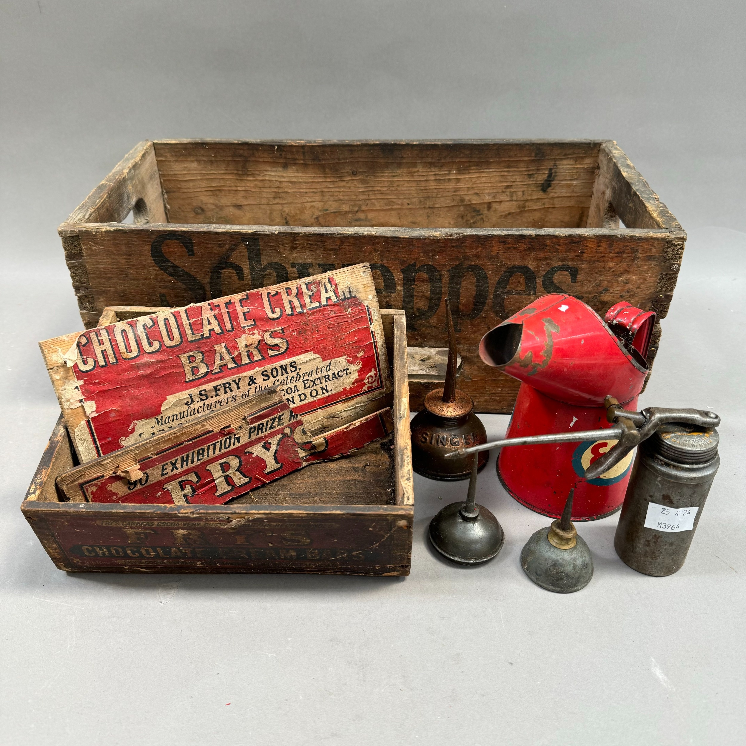 A vintage Schweppes wooden crate with finger grips, a small wooden box for Frys chocolate cream bars