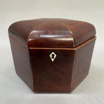 A 19th century elongated hexagonal tea caddy with domed cover, boxwood stringing, bone escutcheon,