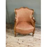 An early 19th century style fruitwood and bergere caned armchair having a square back, upholstered