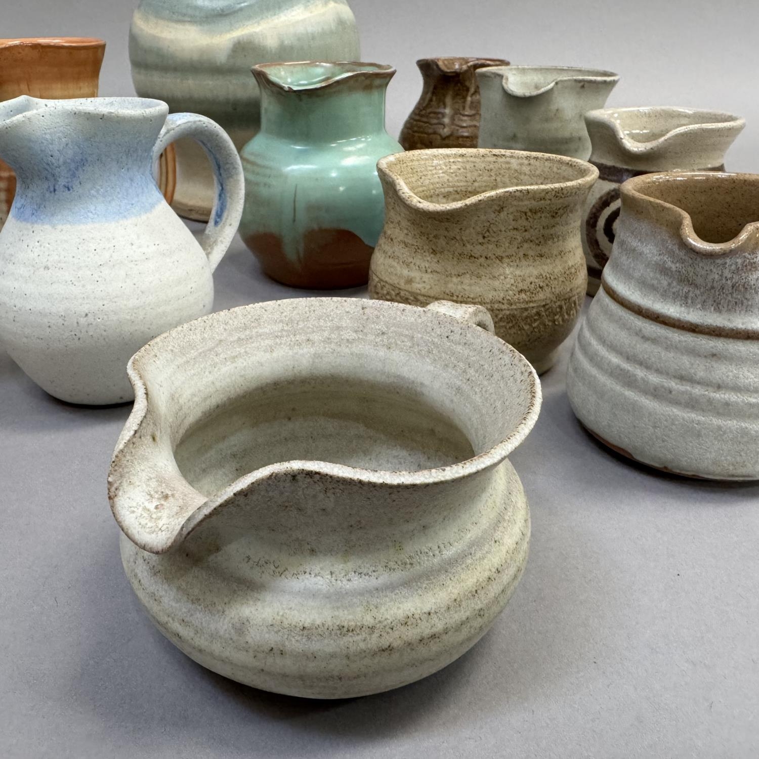 A collection of studio and other pottery jugs including Moffat Pottery Scotland, ,Riverstone, - Image 2 of 3