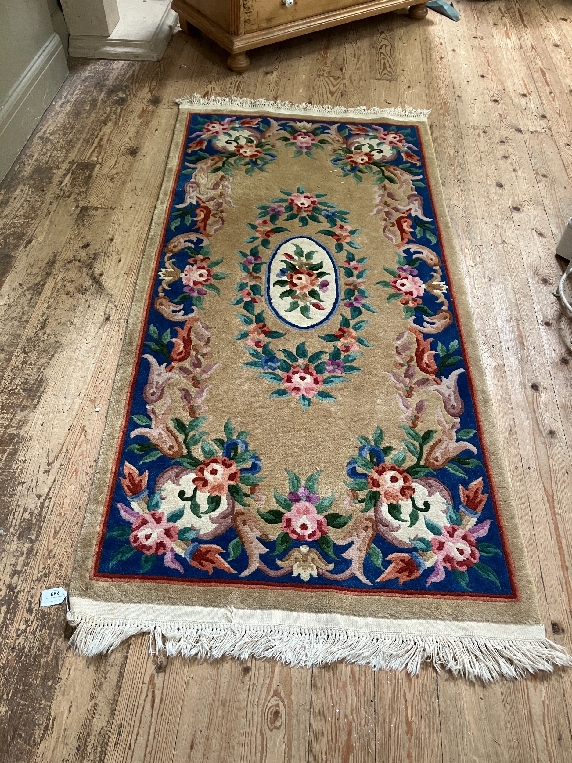 A Chinese wool rug of blue, rose, green, ivory and camel in a floral design - Image 2 of 2