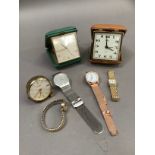 A collection of wristwatches and travel clocks by makers including Oris, Smith, Looping, Skagen