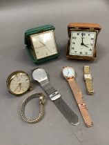 A collection of wristwatches and travel clocks by makers including Oris, Smith, Looping, Skagen