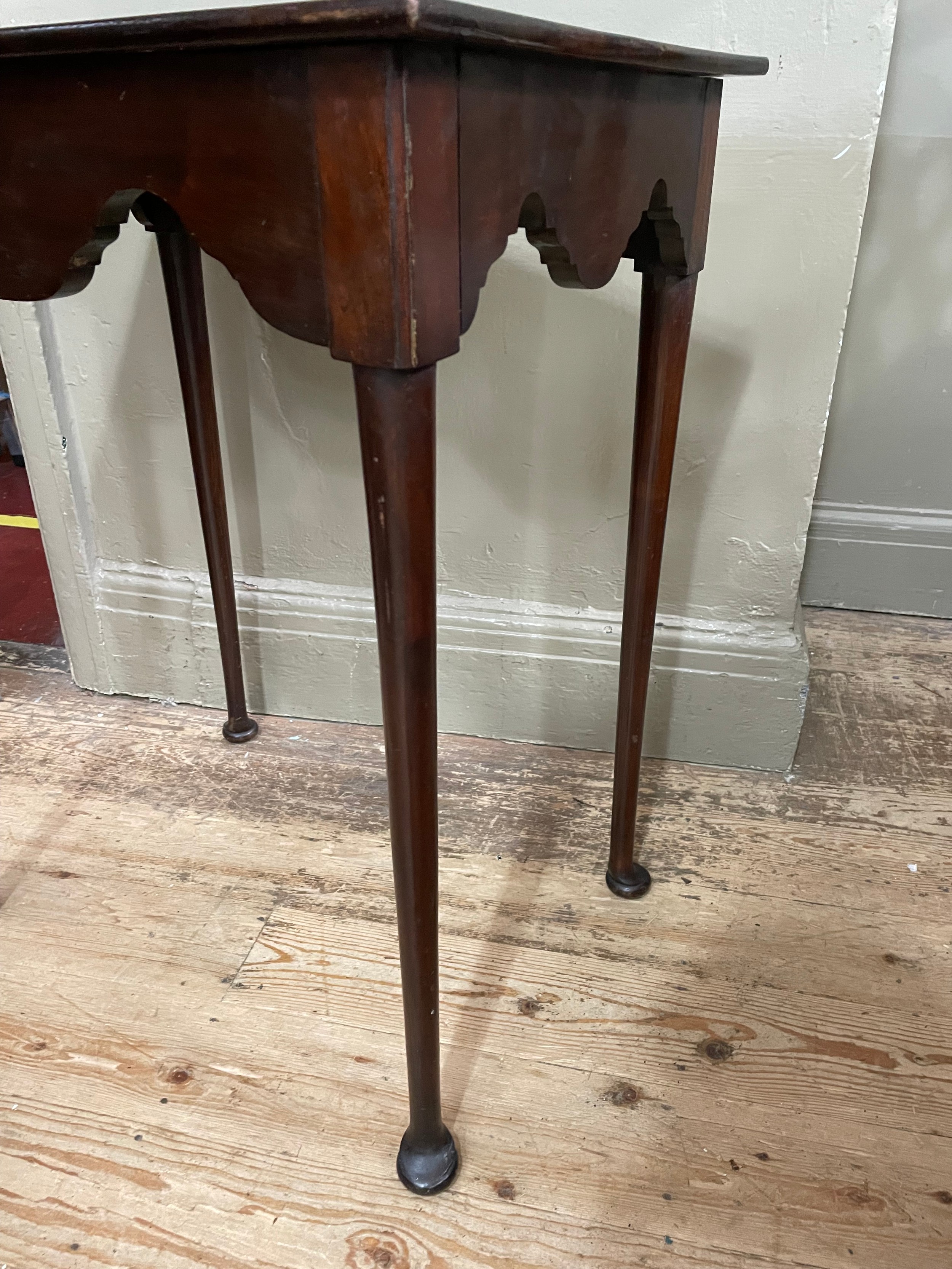 An 18th century and later mahogany table, rectangular, having a deep wavy apron, slender rounded - Image 2 of 2