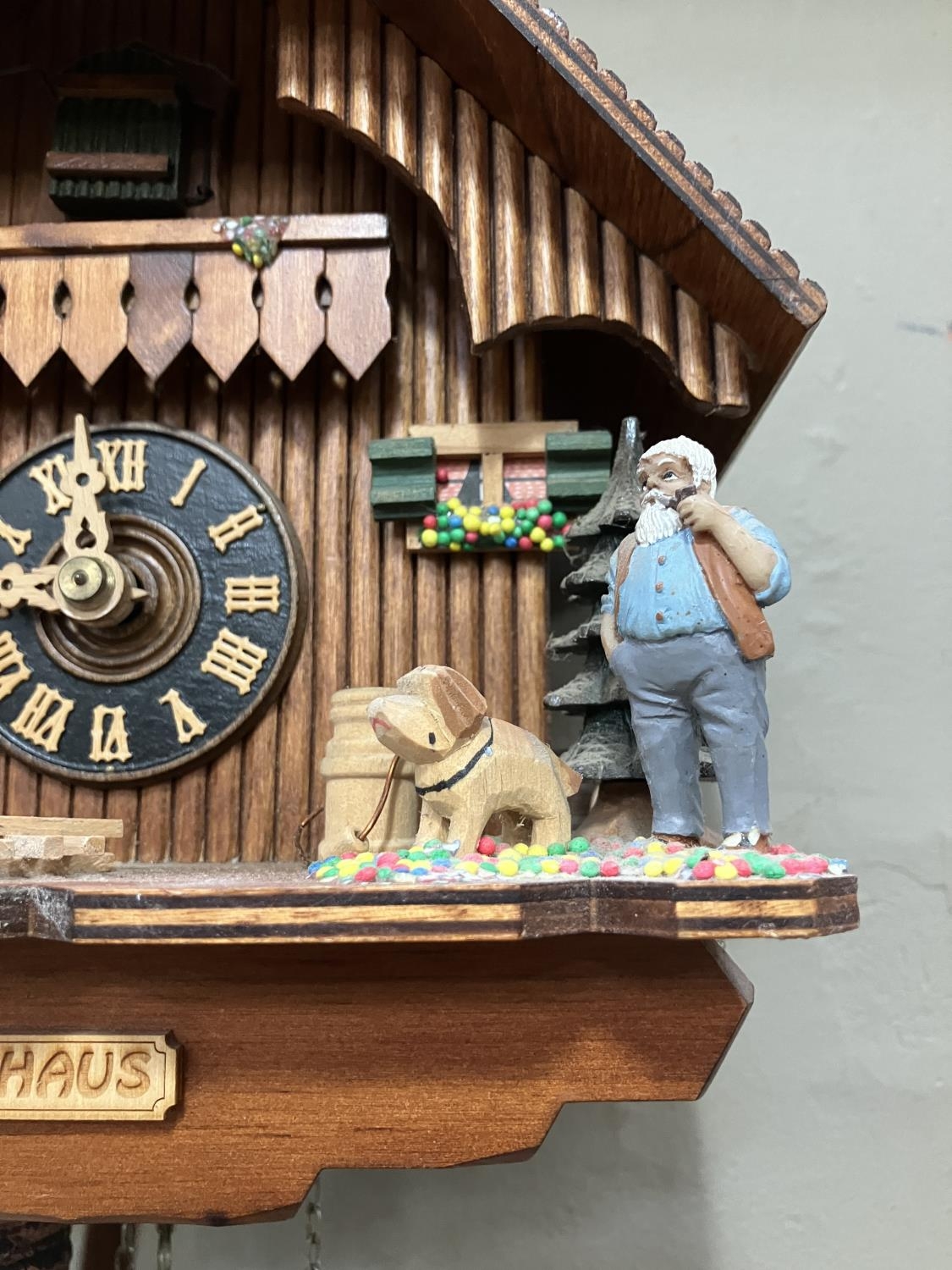 A Black Forest style cuckoo clock with swinging pendulum and weights having two figures , goats - Image 3 of 5