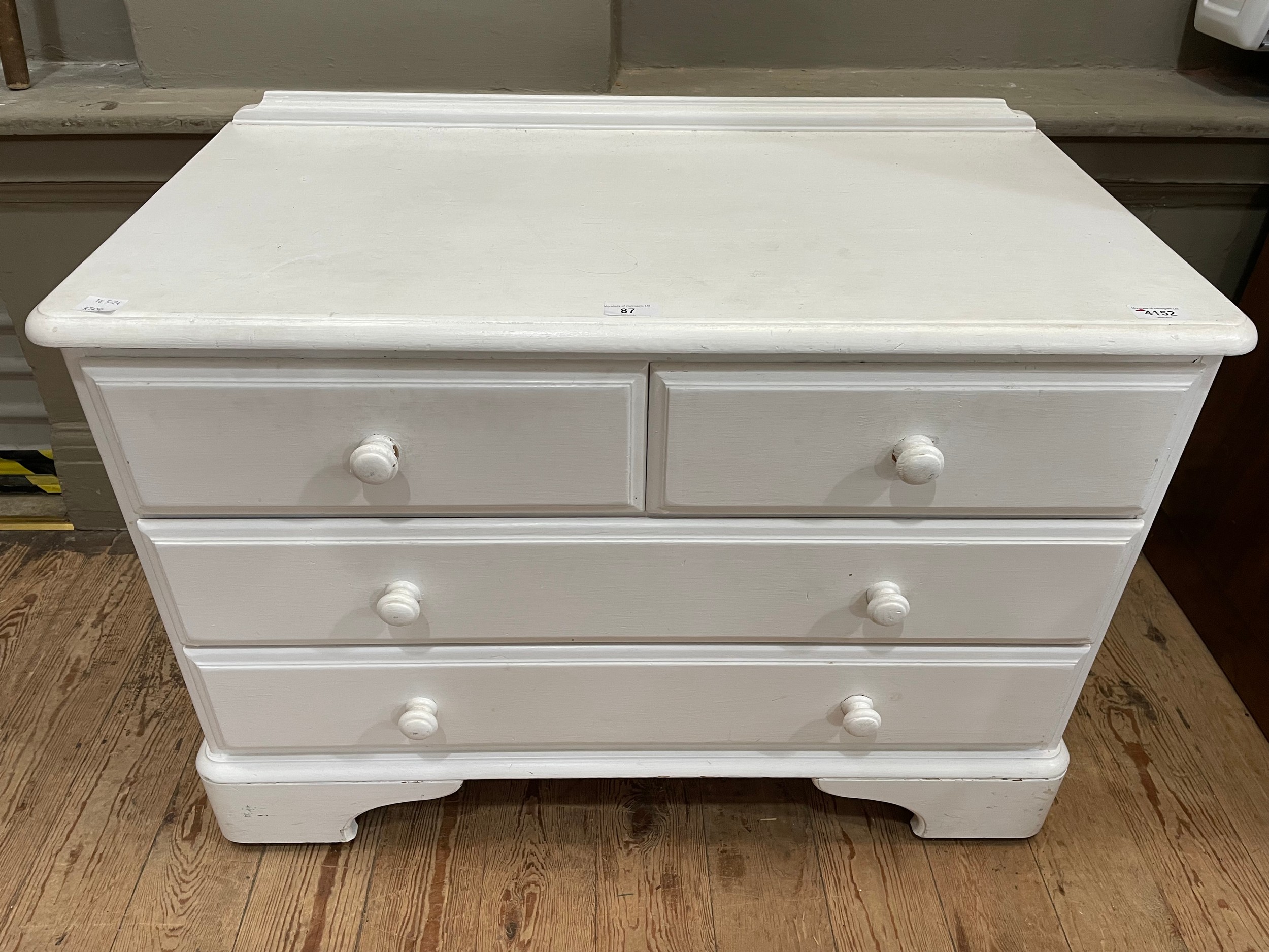 A white painted, possibly pine, chest of two short over two long drawers on bracket feet, 88cm x - Image 2 of 2