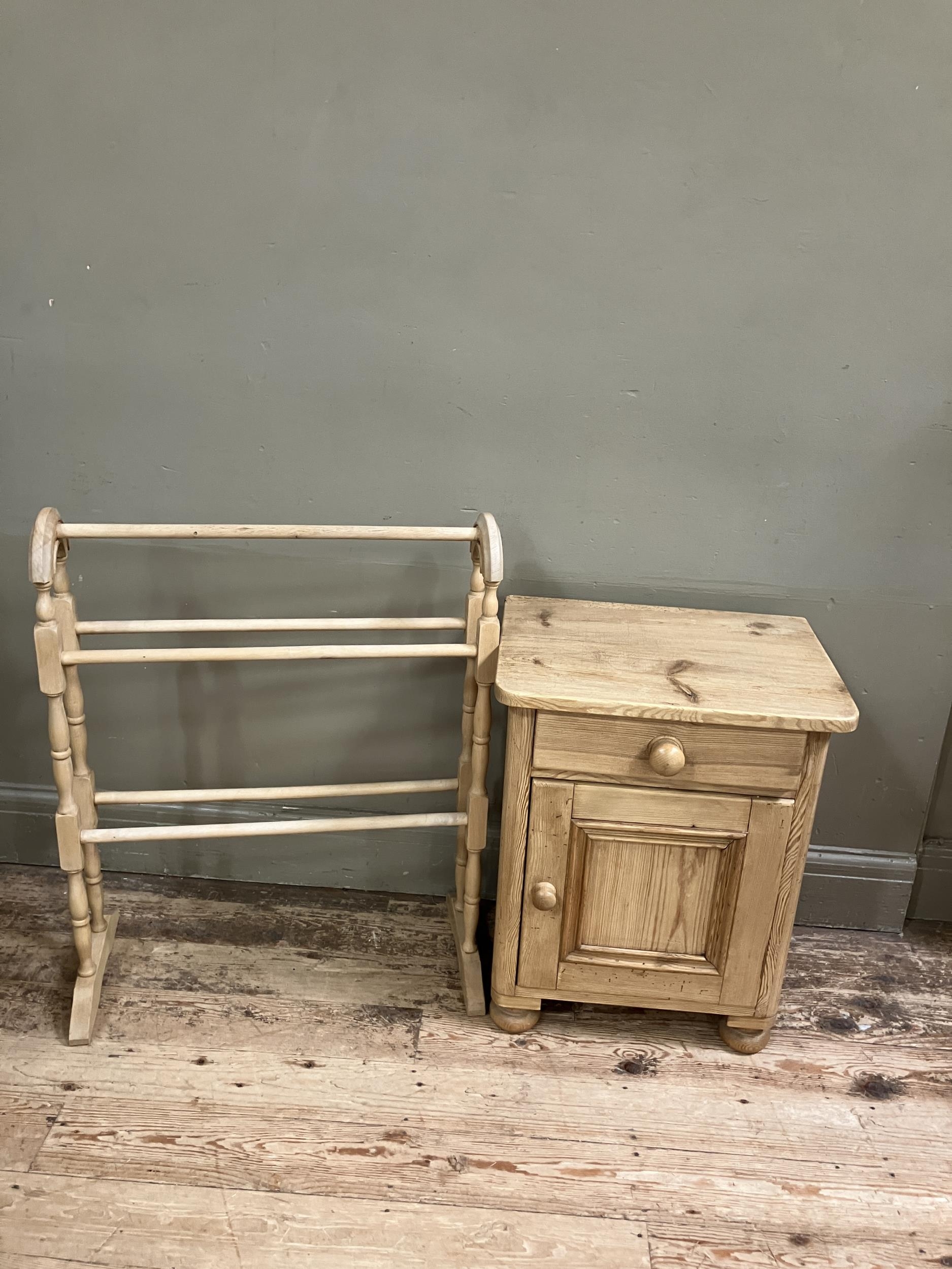 A pine pot cupboard, a drawer above a single door on turned bun feet together with a pine towel rail - Image 2 of 2