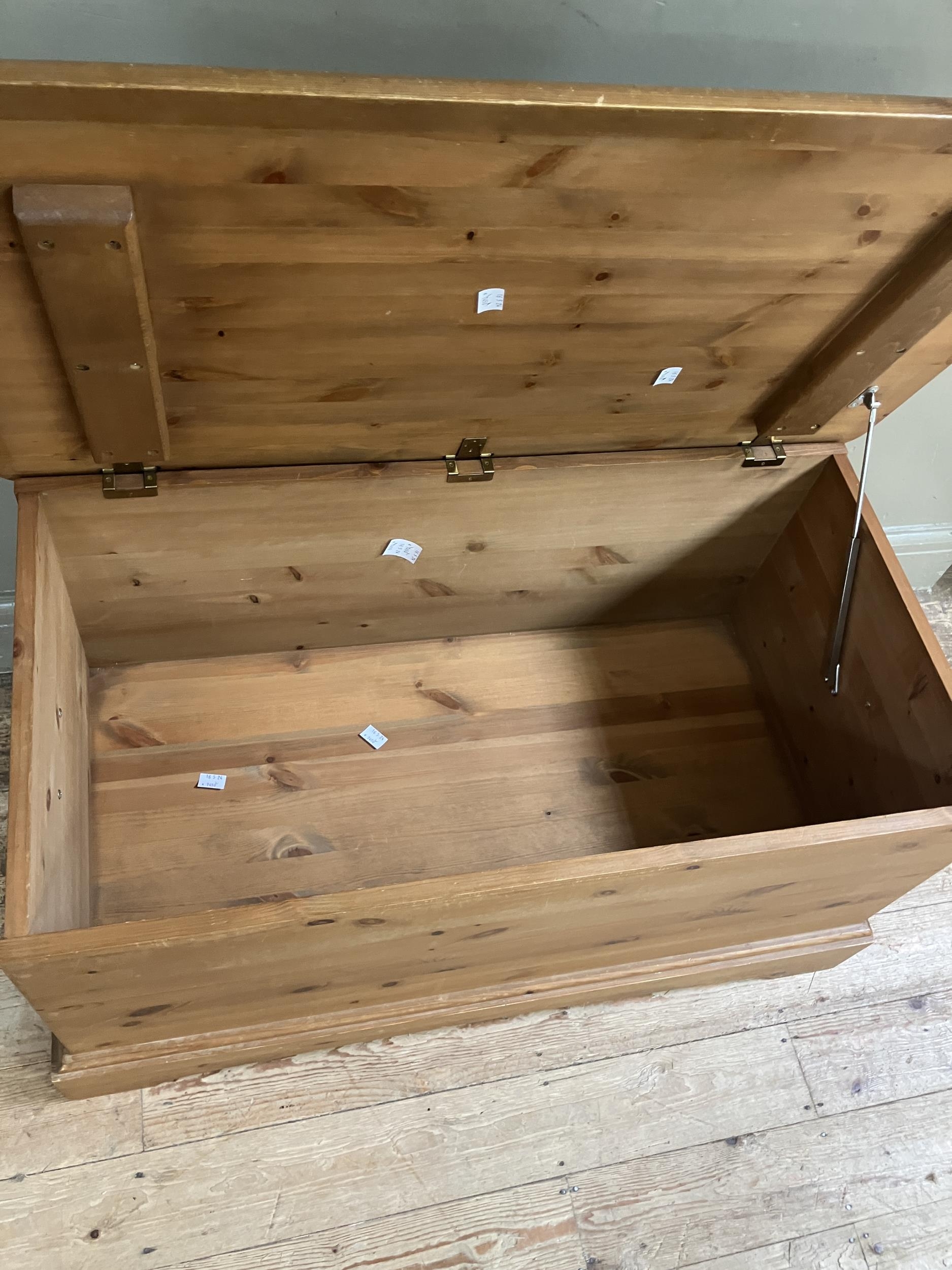 A modern pine blanket chest with brass cup handles and on plinth base, 97cm x 53cm x 50cm - Image 3 of 3