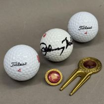 Two House of Lords commemorative golf balls together with ball marker and divot repair tool with