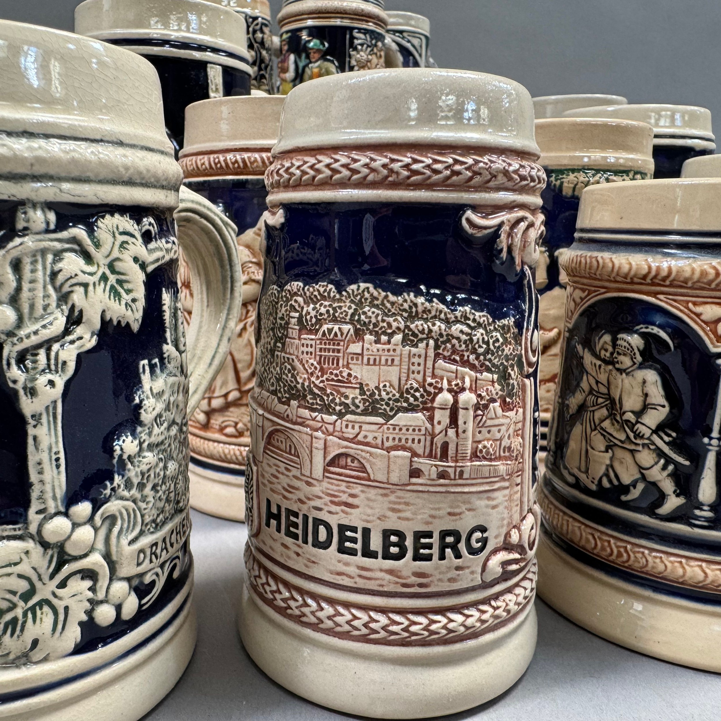 A large quantity of German pottery steins glazed in blue and with relief moulded scenes - Image 3 of 3