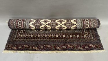 A Caucasian rug, the dark camel ground of conjoined lozenge within multiple borders, colours in dark