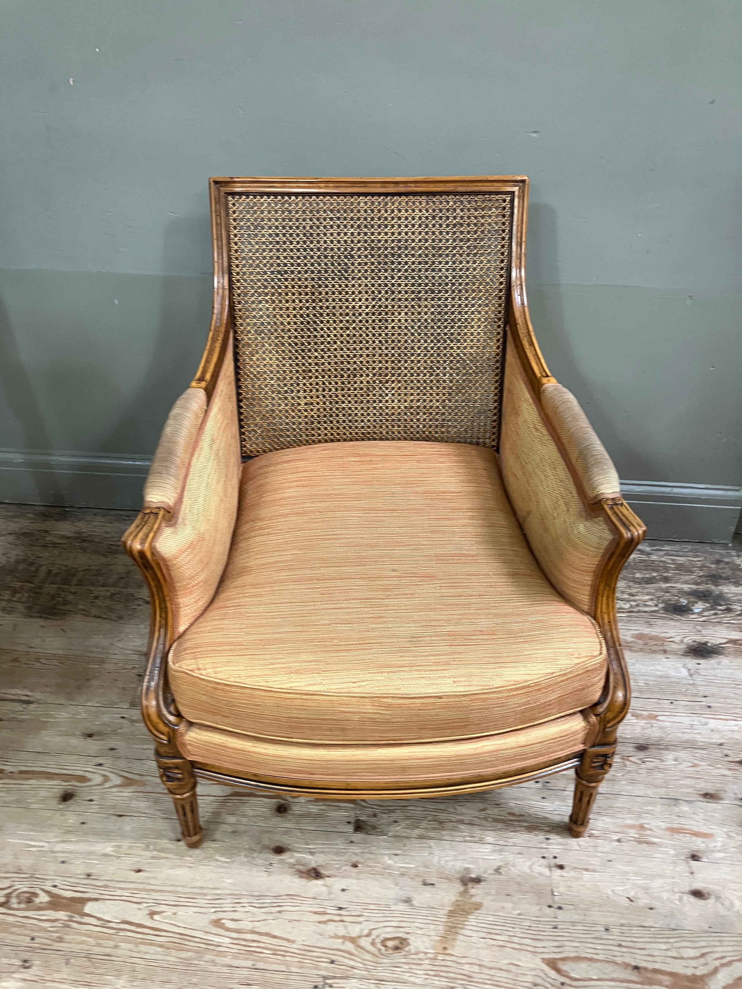 A reproduction French bergere style armchair having a moulded and encircling frame, floral cresting, - Image 2 of 2